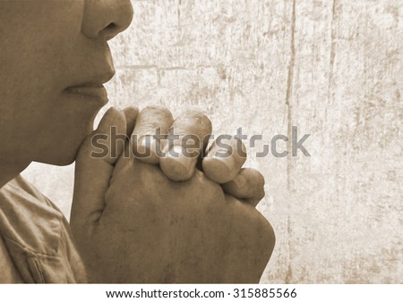 A young woman praying alone with God