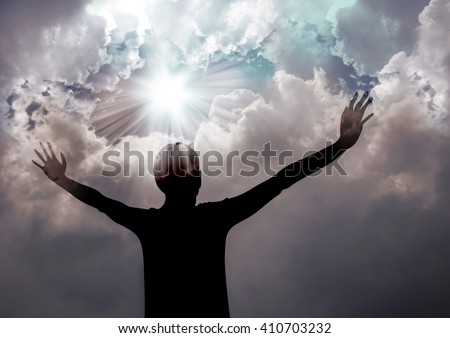 Woman praise the lord- Silhouette of a woman praising to God