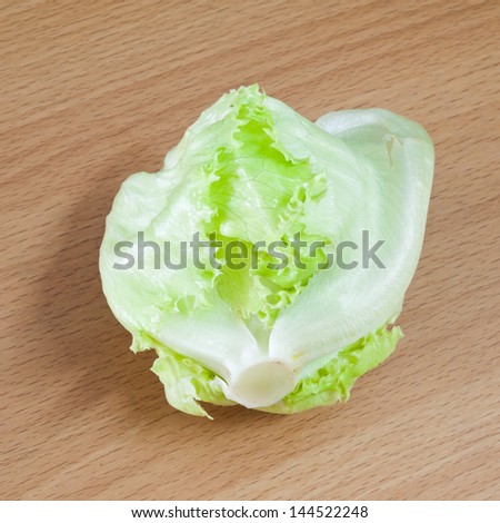 Green Iceberg lettuce on wooden Background
