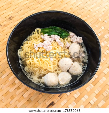 Eating instant noodle with minced pork and pork ball