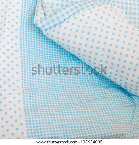 detail of a cotton dot blanket