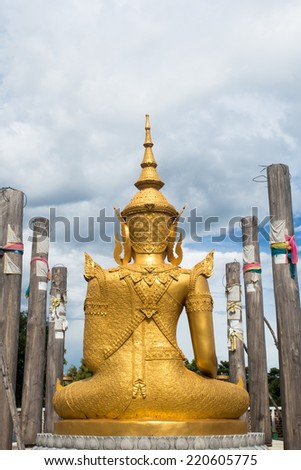 Back of gold Buddha statue in temple of Thailand
