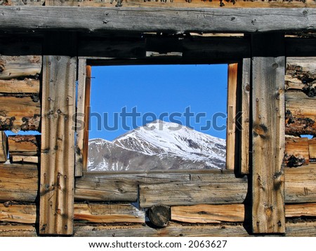Mountain view through and old cabin
