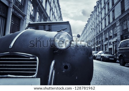The Front Of An Old Run-Down Car (Citroen 2cv) In A Little Street In Paris, France.