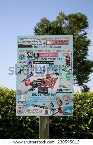 DUNEDIN, NEW ZEALAND - FEBRUARY 02, 2011: Various Surfing and Outdoor Logo Stickers on Parking Sign on February 02, 2011 in New Zealand