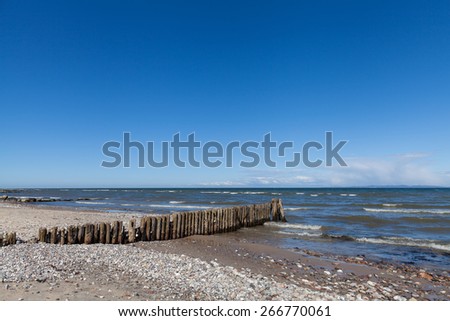 Wooden Wave Breaker on European Beach Coast