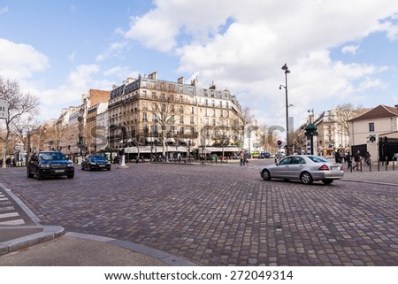 PARIS, FRANCE - MARCH 31, 2015: Typical Street with Cars on March 31, 2015 in Paris, France