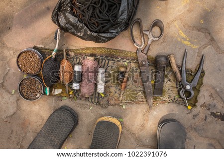 Indian street shoemaker tools close up