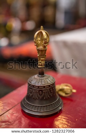 Buddhist religious equipment - Vajra Dorje and bell. Close up view in tibetan buddhist monastery in Ladakh