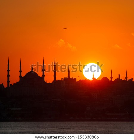 Istanbul silhouette. Blue Mosque and Hagia Sophia at sunset.