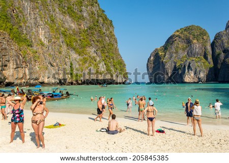 PHI PHI ISLAND,THAILAND-FEBRUARY 25, 2014:Tourists on the wonderful Maya beach of Phi Phi Leh island Thailand on 25 February, 2014.