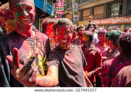 KATHMANDU, NEPAL - MARCH 26: People covered in paint on Holi festival, March 26, 2013, Kathmandu, Nepal. Holi, the festival of colors, marks the arrival of spring.