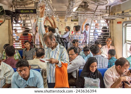 MUMBAI, INDIA - DECEMBER 12, 2012: Unidentified passengers inside Indian Railway local train on December 12, 2012 in Mumbai, India. Indian Railways carries about 7,500 million passengers annually.
