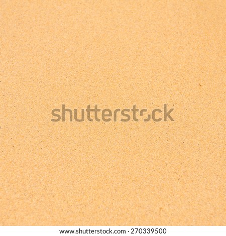 Sand beach background with blurry areas up and down of the frame