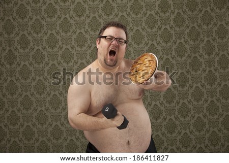 horizontal, color image of an overweight male lifting weights and holding a pie