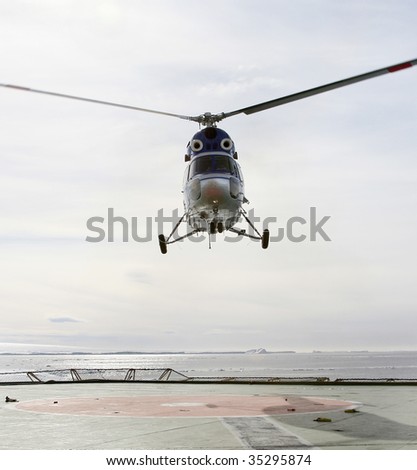 Helicopter landing on a Russian icebreaker in the Weddell Sea, Antarctica