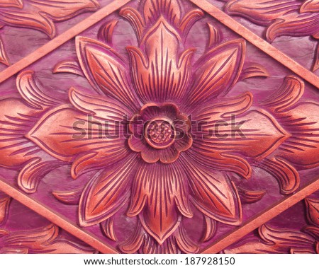 Pattern of flower carved on wood background. hand made in asia