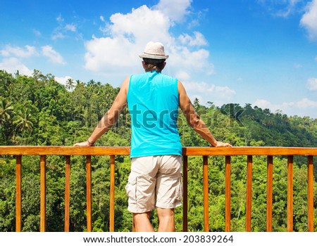 traveler on top of watching a beautiful view