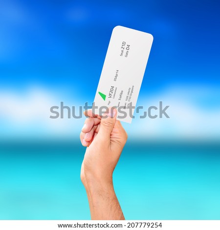 male hand holding a boarding pass