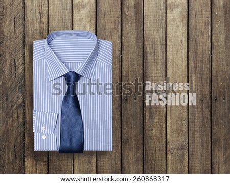 blue shirt on a wooden brown background