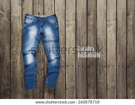 Jeans on a wooden background