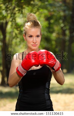 girl boxer with gloves to guard