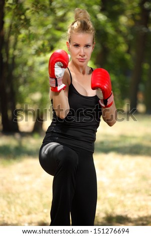 girl boxer with gloves to guard