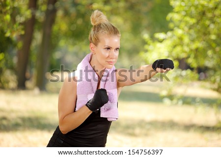 female boxer in guard, direct