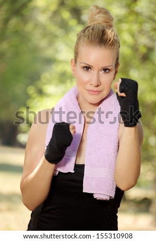 Girl in boxing guard exercise in the park 4