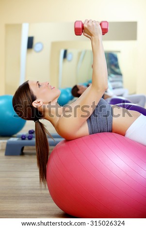 Pilates woman stability ball gym fitness yoga exercises girl