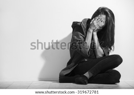 Woman victim of domestic violence and abuse,black and white photo.