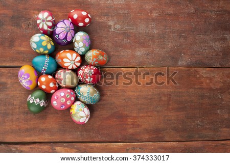 Colorful easter eggs old brown wooden board