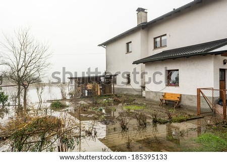 House with its gardens flooded after spring thaw