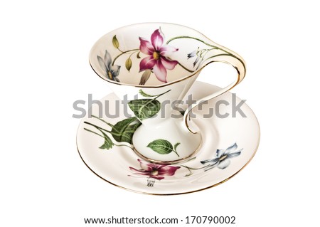 Antique China tea cup and saucer with leaves and delicate flowers.Has no background/Antique China tea cup and saucer with leaves and delicate flowers