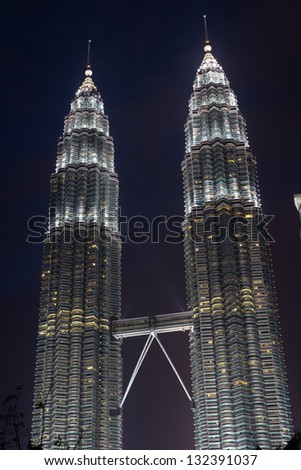 KUALA LUMPUR, MALAYSIA - FEBRUARY 23: Petronas twin towers in lights at night on February 23, 2012. Twin towers is the one of the highest buildings in Asia and the most famous symbol of Kuala Lumpur.