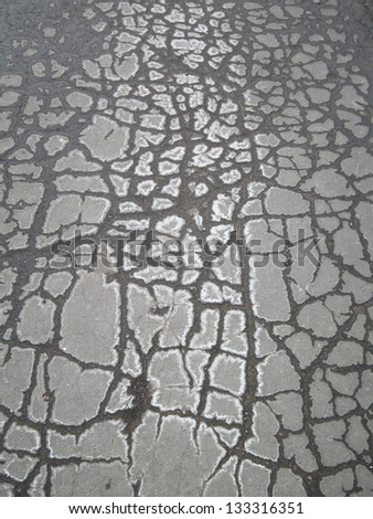 Dark, cracked old asphalt (cold, winter, spring, outdoor, walk, step, cold, ice, snow, crack, cracked, texture, old)