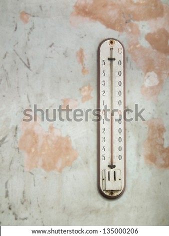 Old thermometer on a old colorful vintage wall (heat, climate, display, cast, centigrade, bulb, isolated, meteorology, object, macro, measure, graph, scale, indoor, outdoor, fahrenheit, arrow)