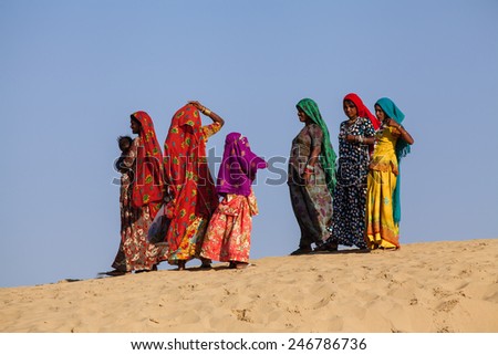 Jaisalmer, India - February 25, 2013: Camel riding at the Sam Sand Dune. The activity is part of the Desert Festival held in winter to attract both domestic and international tourists.