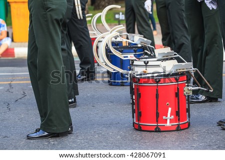 Red  Bass Drum are  in Parade waiting for Marching Band to perform