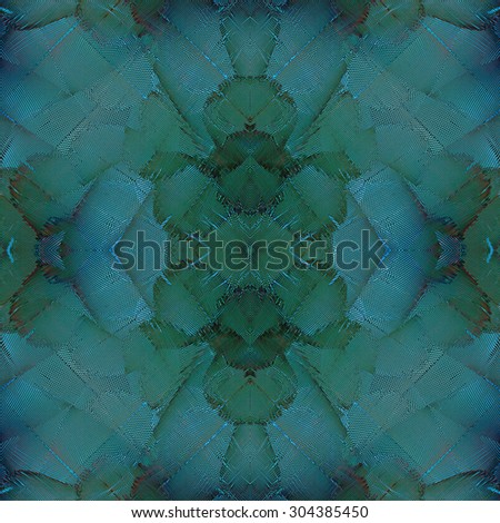 Exotic green and blue background texture made of blue and gold macaw bird\'s feathers