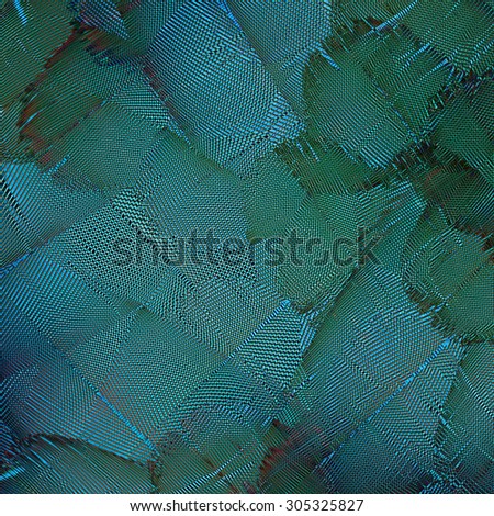 Exotic green and blue cross lines and background texture made of blue and gold macaw bird's feathers