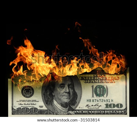 Burning dollars close up over black background