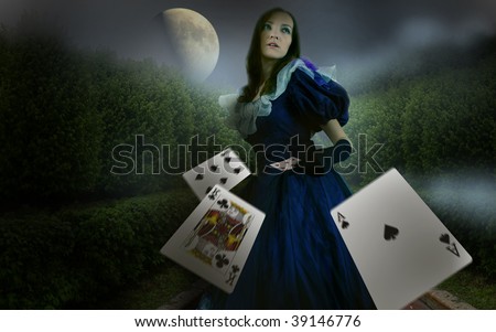 girl in garden with playing cards in the night