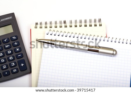 Pen on notebook, isolated on white background.