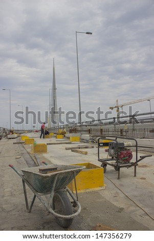 Electric Generator and Classical Concrete Trolley on the construction site of Ada bridge. Focus on generator and Trolley. On Sava River, in Belgrade, Serbia