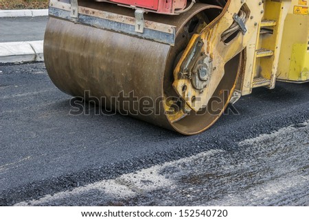 compactor roller during road construction at asphalting work