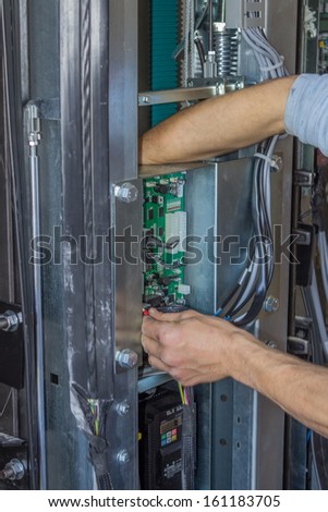 Installing elevator control panel, elevator parts installation