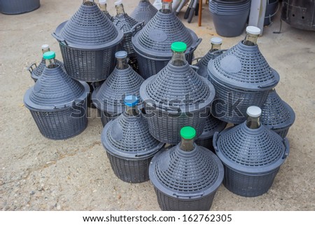 pile of gallons for water and wine at store