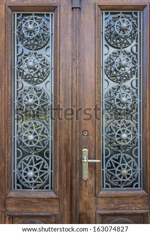 Beautiful wood door with metallic ornament in Belgrade, Serbia
