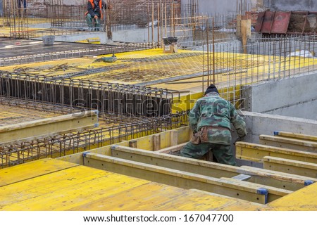 Builder worker assemble a form to prepare for a concrete pour